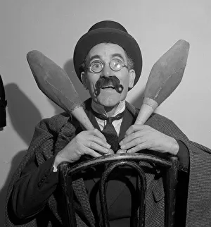 00126 Prints: Comedian Eddie Gray seen here holding skittles wearing a false moustache Comic