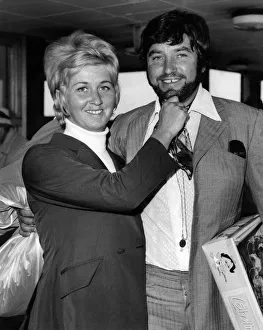 Comedian Jimmy Tarbuck flew into London airport today sporting a beard