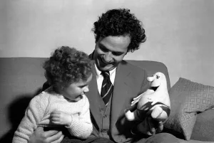 1953 Prints: Comedian Michael Bentine seen here with a Bumble puppet and his son Gus