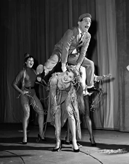 Comedian Norman Wisdom with cast members of his pantomime The Wonderful Lamp 1956