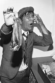 00671 Collection: Comedian Norman Wisdom seen here in the persona of hapless on screen character Norman