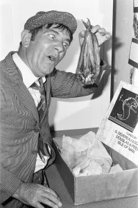 00671 Prints: Comedian Norman Wisdom seen here in the persona of hapless on screen character Norman