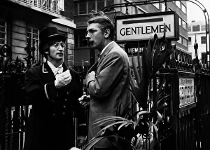 Comedian Peter Cook stands in Carnaby Steet during the filming of sketch for