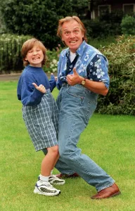 Comedian Rik Mayall and his son Sidney pulling funny faces. 12th September 1998