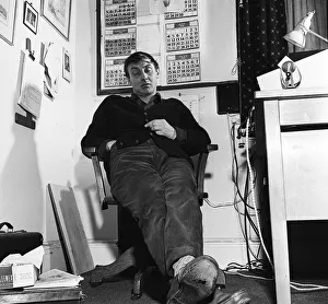 Comedian Spike Milligan asleep at his desk 1958 A&copy;mirrorpix