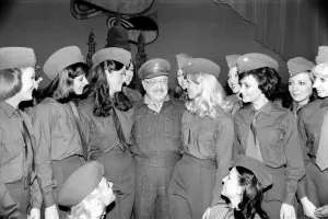 Comedy actor Arthur Lowe of Dads Army surrounded by girls