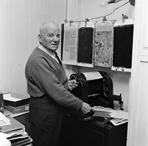 Commander Bill Boaks working in his one man staffed office in his Kingston home