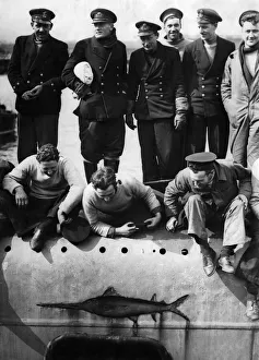 The Commander with Lieutenant Pirie and the crew standing on the deck of the submarine