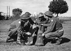 01444 Prints: Company Sergeant Major Plunkett explains the working of the butterfly bombs