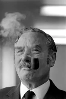 A competitior in the British National Pipe Smoking Championship puffing on his pipe