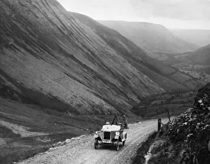 Competitor in the 1923 Liverpool Motor Club Reliability Cup seen here ascending one of