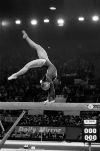 Competitor on the beam in the Champions All'Gymnastics Competition
