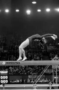 Competitor on the beam in the Champions All'Gymnastics Competition