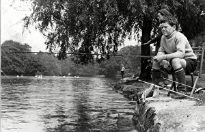 00089 Prints: Concentration and determination reflected on the faces of these young fishermen enjoying