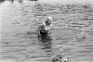 00007 Prints: A concert goer cools of in the serpentine during the free Rolling Stones concert in Hyde