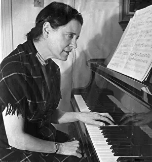 00072 Prints: Concert pianist Harriet Cohen, practiicng the piano left handed after she injured her