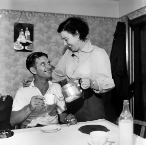Repatriation Prints: Conflict: Korean War. Prisoner of War Tommy Nugent seen here arriving home after being