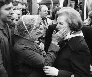 Conservative Party leader Margaret Thatcher receives an affectionate pat on the cheek