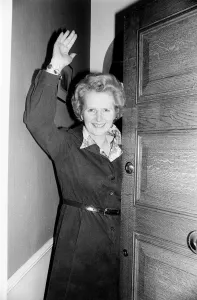 00198 Prints: Conservative politician Margaret Thatcher waves at the front door of her home May