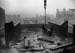 Construction of the new Tyne Bridge. The huge steel framework which has been assembled