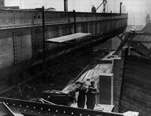 Construction of the new Tyne Bridge. The huge structure of the new Tyne Bridge is given a