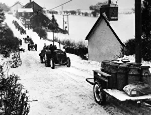 Convoy of vehicles managing to deliver milk to even the most remote areas in Wales