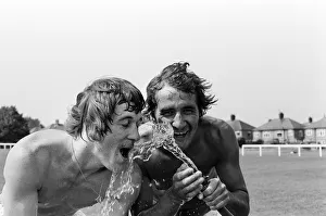 Hosepipe Prints: Cooling off after training in a heatwave are Leicester City footballers Steve Kember