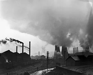 Cooling towers and smoking chimneys pollute the air at a Sheffield industrial site