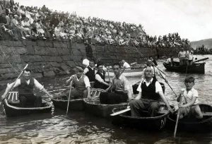 00362 Prints: Coracle Racing - These coracle men, their age old craft slung about their shoulders