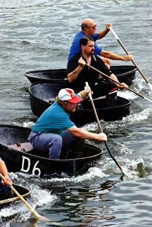 00362 Prints: Coracle racing - The tradition of coracle racing returned to the Tywi at the weekend - as