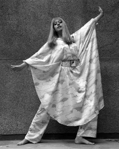 1960s Fashion Prints: Corina Scott in Simon Massey element print trouser outfit with cape / batwing sleeves