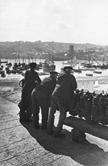 00087 Prints: Three Cornish fishermen seen here in St Ives leaning on the harbour railings