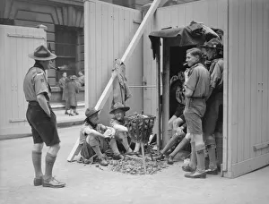 Tobacco Prints: Coronation of King George VI. Boy scouts sit down for a cigarette as they await
