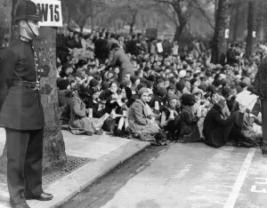 Coronation of King George VI. Policeman on guard as huge crowds gather to watch