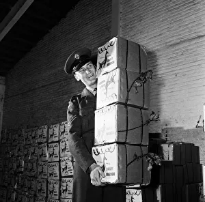 Corporal Peter Symmonds at a Nicosia airfield with hampers packed with good things