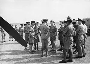 01450 Prints: Correspondents talking to W / Cdr. H. Law-Wright (centre). 14th October 1943