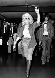 Country & Western singer Dolly Parton arrving at London Airport. 16th May 1977