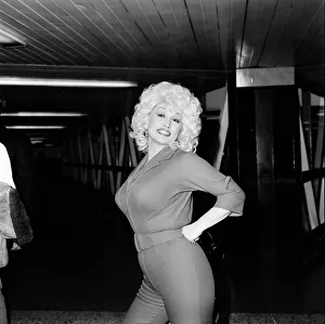 Country & Western singer Dolly Parton arrving at London Airport. 22nd March 1983