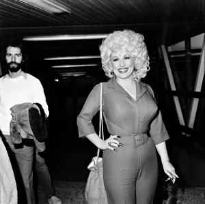 Country & Western singer Dolly Parton arrving at London Airport. 22nd March 1983