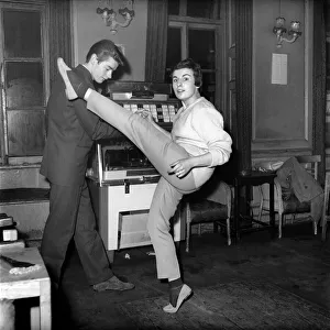Couple dancing to music from juke box. 1960