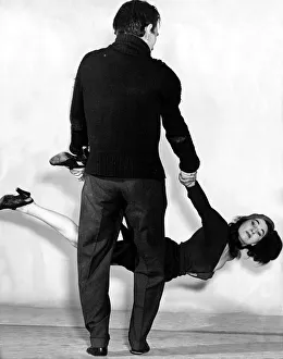 A couple performing the apache dance October 1954 Man swings woman dancer