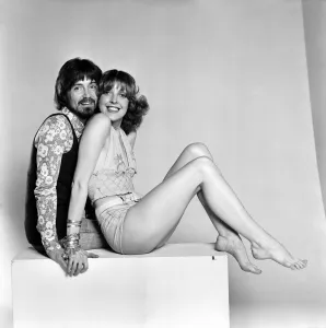 00068 Prints: Couple wearing 1970s fashion. The woman wearing a matching top