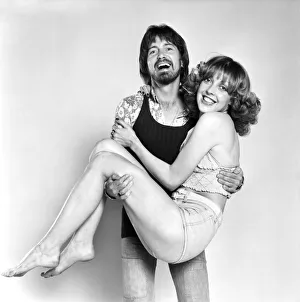 Couple wearing 1970s fashion. The woman wearing a matching top