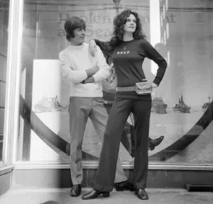 Sweater Prints: Couple wearing the latest leisurewear which has a maritime theme seen here posing outside