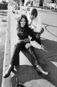 Couple wearing the latest leisurewear pose by a boat. November 1969 Z10672-001