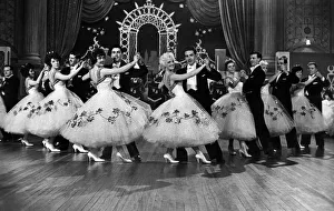 Couples on the dance floor during the filming of the BBC television programme Dancing