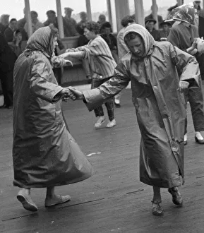 Couples rock and roll dancing on the central pier during Blackpool week August 1958