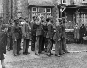 01248 Prints: US Court Martial at Paignton. The accused leaving the court after the adjournment