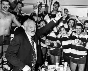 Coventry match secretary Harry Walker punches the air in jubilation as he joins in