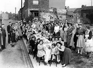 Street Party Prints: Coventry street party among the remains of bomb damaged buildings to mark the end of